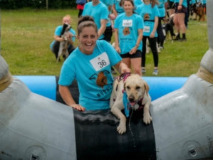 Sam with a dog during agility training